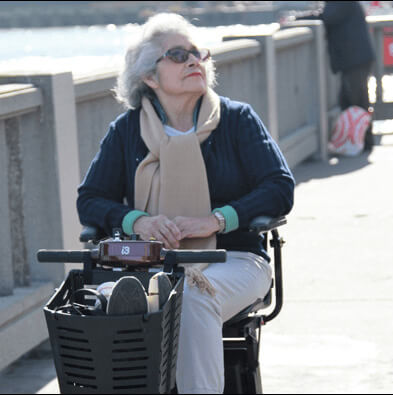 elderly on mobility scooter